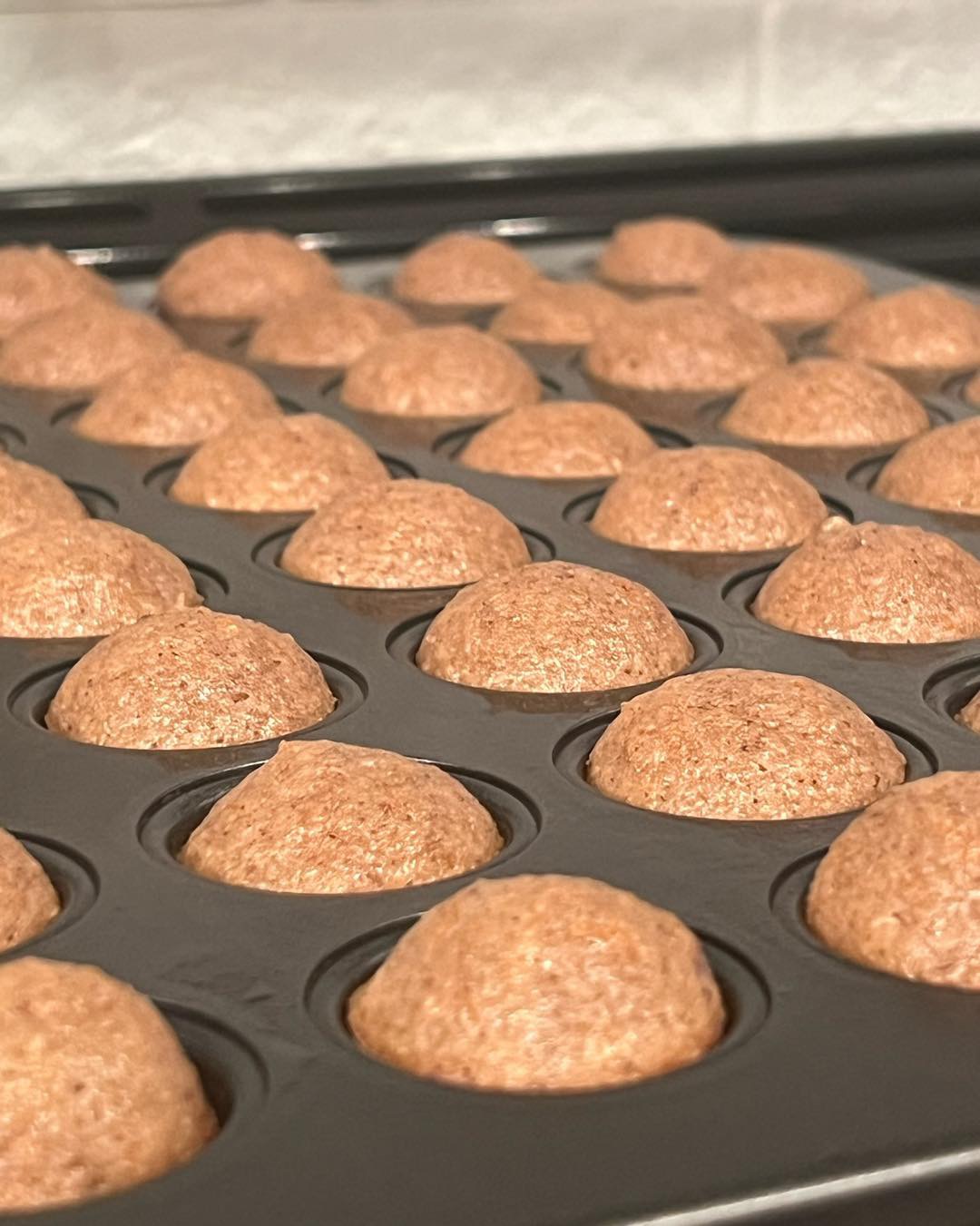 Sweeties cakes in a mini baking tray before frosting